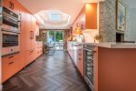 Kitchen Features JennAir Appliances, Large Skylight and Breakfast Nook